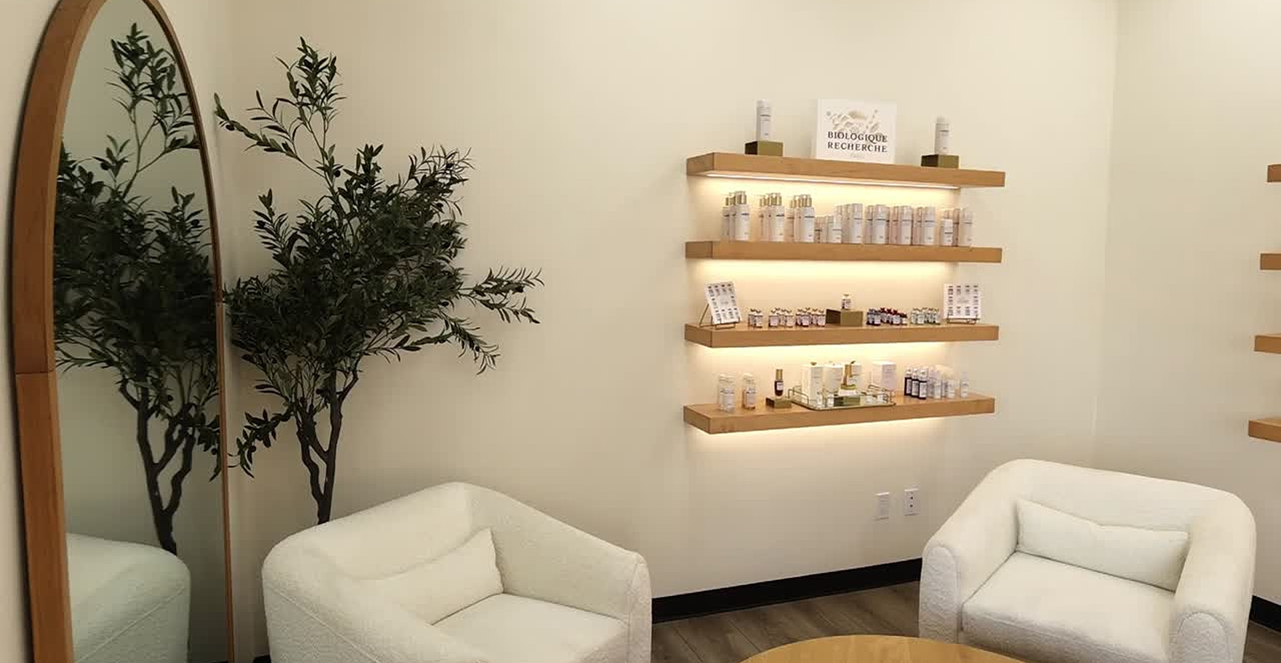 Spa interior with products and cozy seating.
