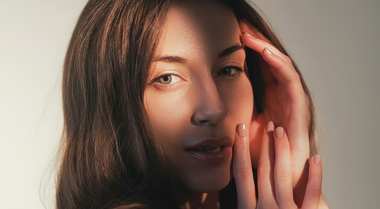 Smiling woman with natural makeup and flowing hair